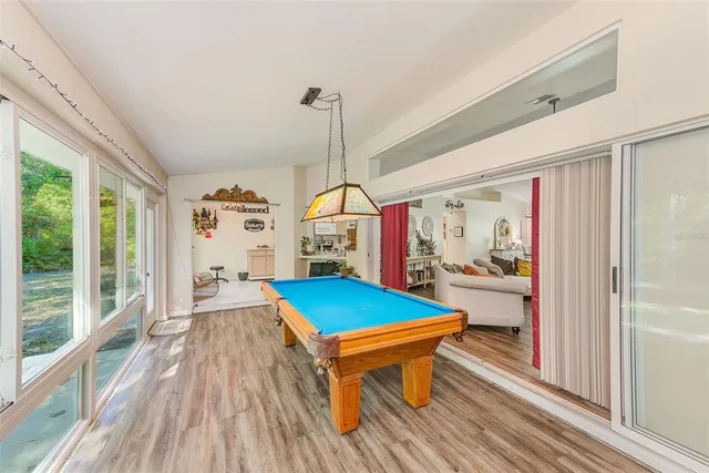 a outdoor space with lots of furniture and wooden floor