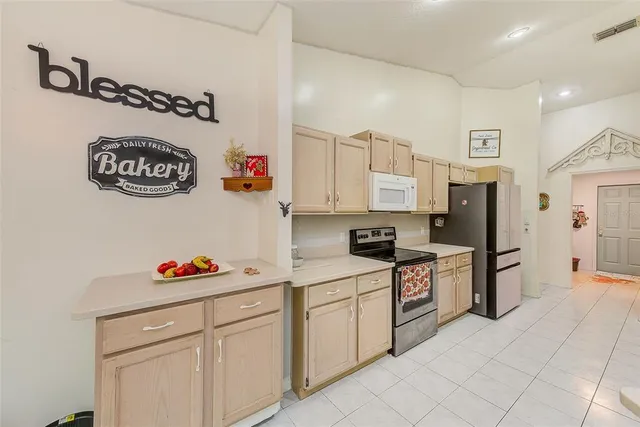 a kitchen with cabinets a sink and a stove top oven