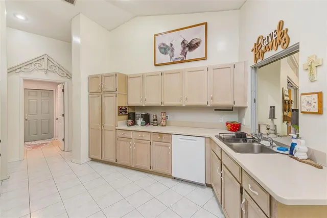 a kitchen with a cabinets and window