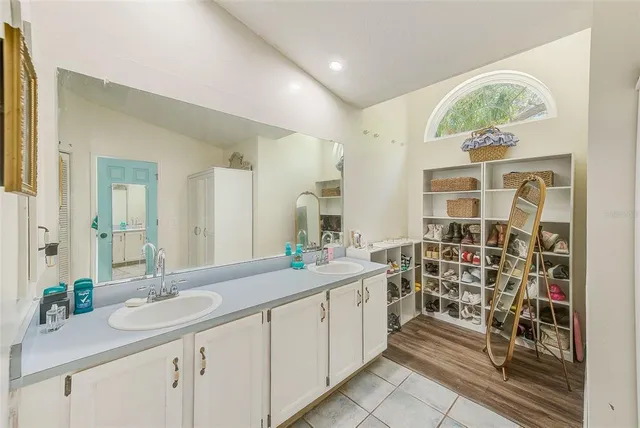 a white toilet sitting next to a bathroom sink