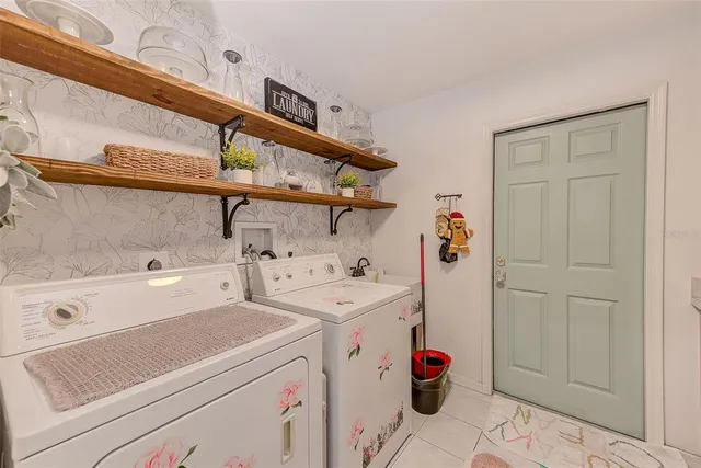 a view of a dining room with furniture large windows and wooden floor