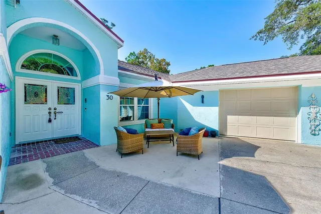 a view of a backyard with swimming pool