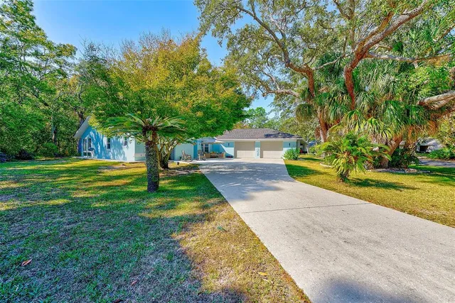 a view of house with backyard and entertaining space