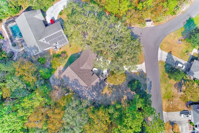 an aerial view of a house with a yard and garden