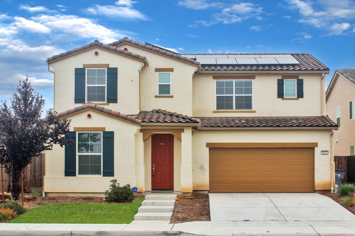 4826 North Casey Avenue Fresno, CA 93723 - Photo 17 of 36 a front view of a house with a garden