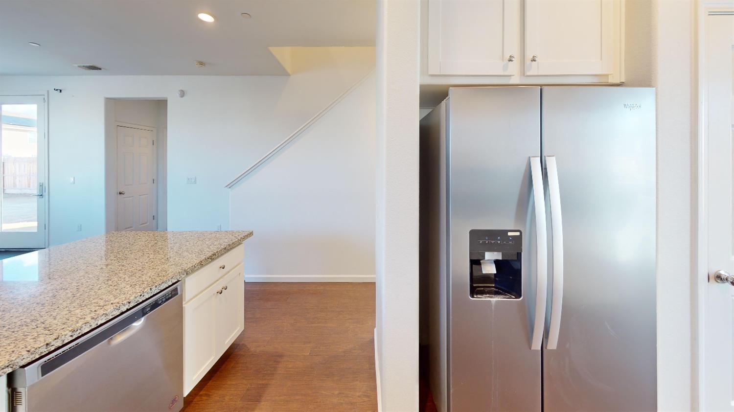 4826 North Casey Avenue Fresno, CA 93723 - Photo 21 of 36 a kitchen with stainless steel appliances granite countertop a refrigerator and a sink