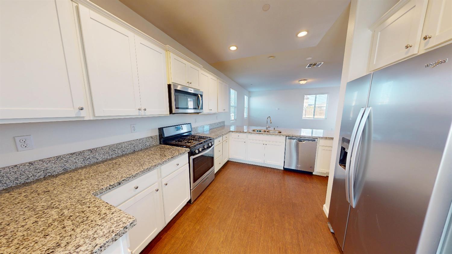 4826 North Casey Avenue Fresno, CA 93723 - Photo 22 of 36 a kitchen with stainless steel appliances a refrigerator sink and microwave