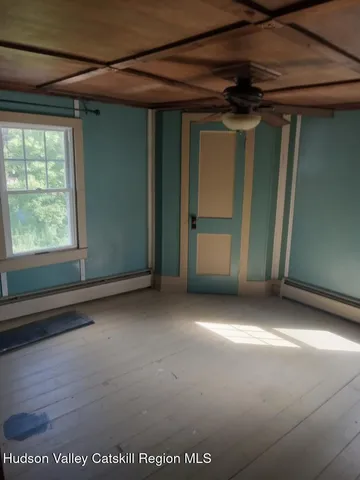 a view of an empty room with a fireplace