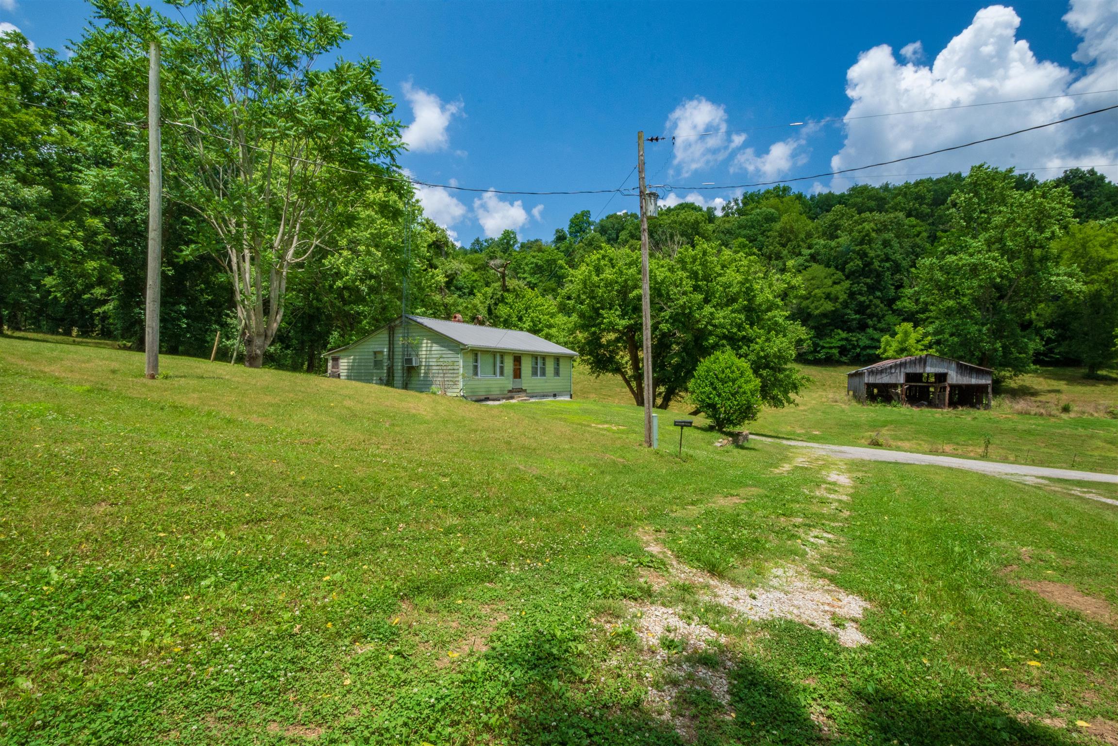 198 Ben Johnson Road Pulaski, TN 38478 - Photo 2 of 30 a house view with a garden space