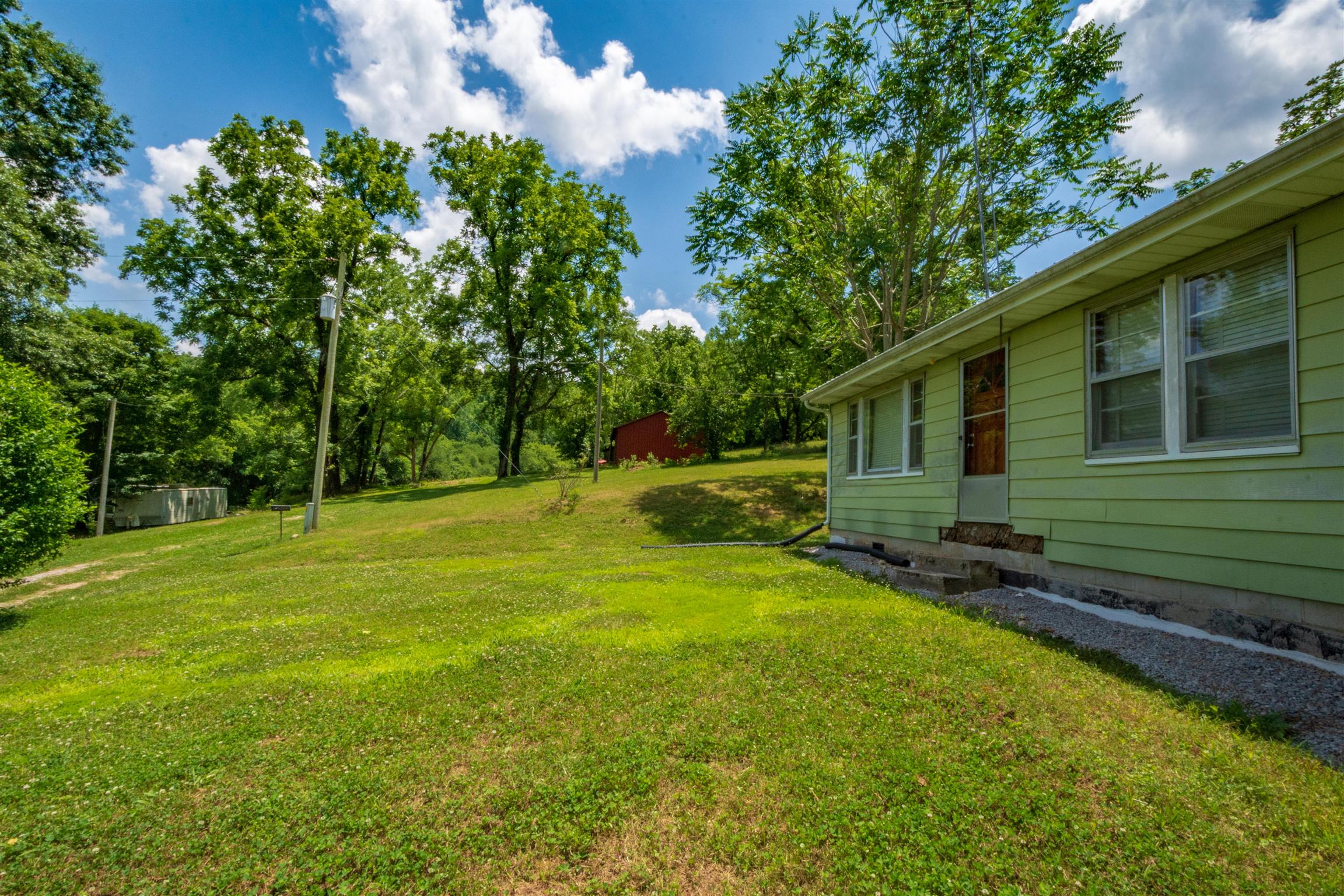 198 Ben Johnson Road Pulaski, TN 38478 - Photo 23 of 30 a view of a house with a backyard