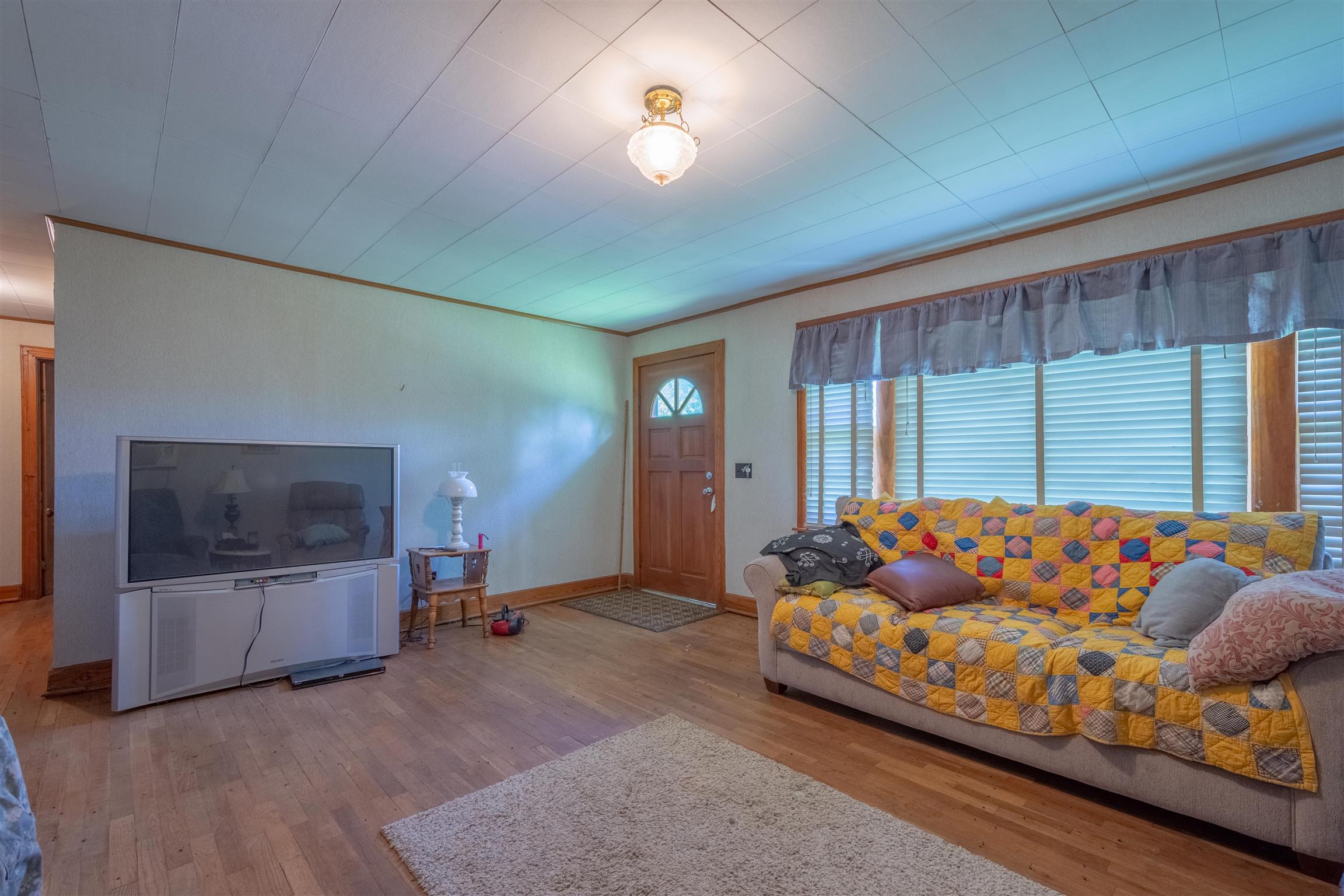 198 Ben Johnson Road Pulaski, TN 38478 - Photo 26 of 30 a living room with furniture and a flat screen tv