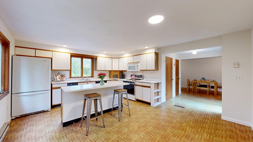 40 Anthony Road North Reading, MA 01864 - Photo 14 of 31 a kitchen with a sink appliances and cabinets