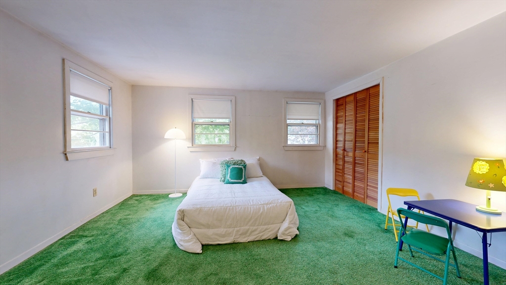 40 Anthony Road North Reading, MA 01864 - Photo 26 of 31 a living room with a bed furniture and a window