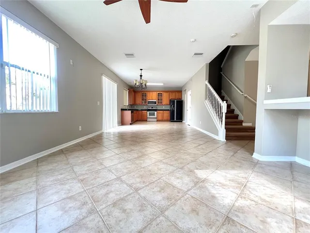 a view of a livingroom with a furniture and a ceiling fan