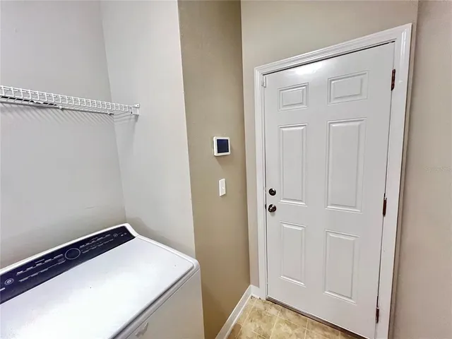 a view of staircase with white walls