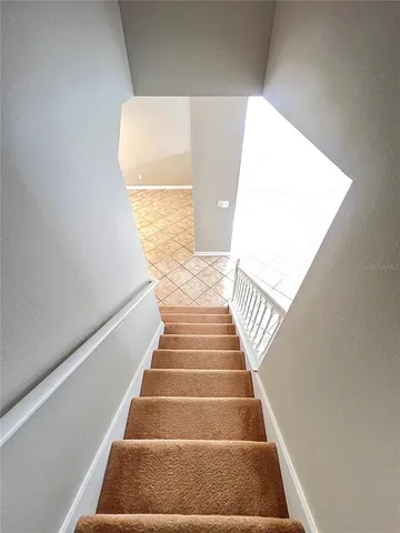 a view of a room with wooden floor and cabinet