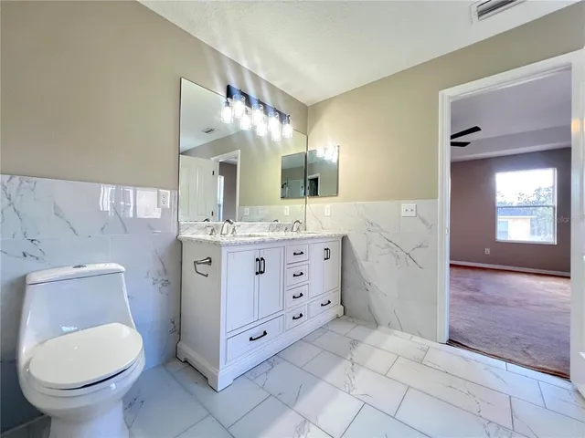 a bathroom with a sink and vanity