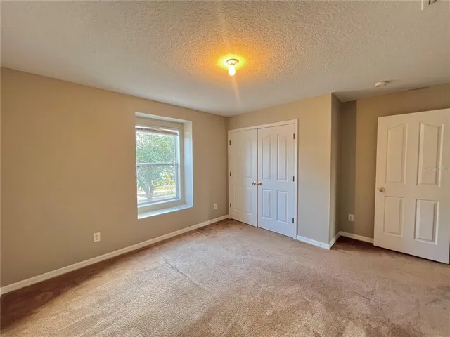 a view of a backyard of the house