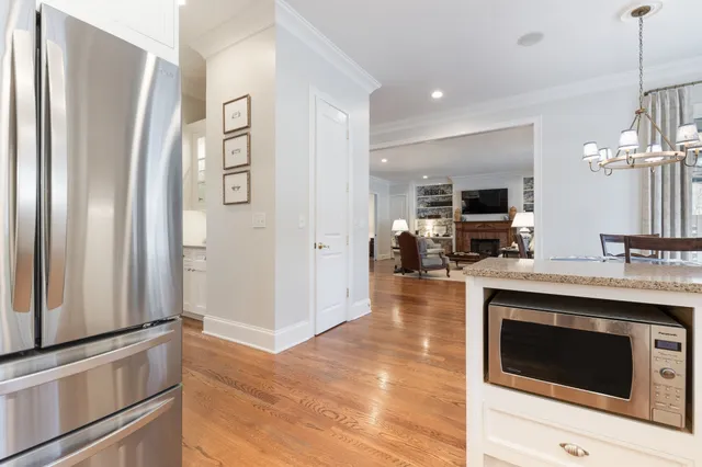 a kitchen with stainless steel appliances a stove microwave and a refrigerator