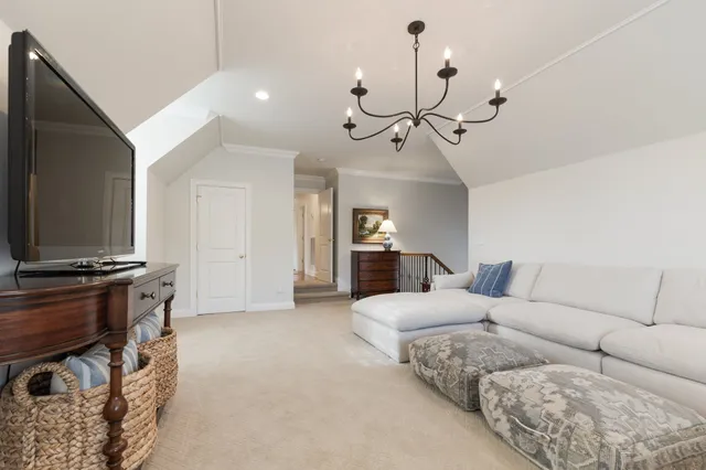 a bathroom with a granite countertop double vanity sink and a mirror