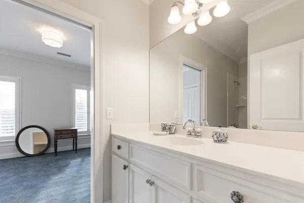 a white toilet sitting next to a bath tub