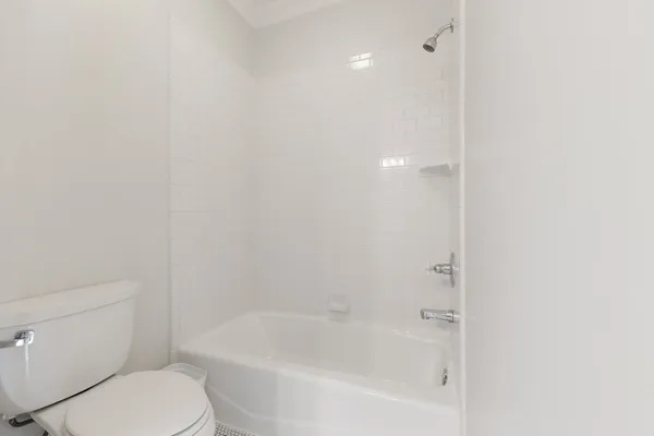 a view of a room with furniture and windows