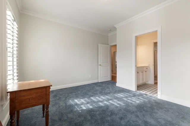 a bedroom with bed and a window