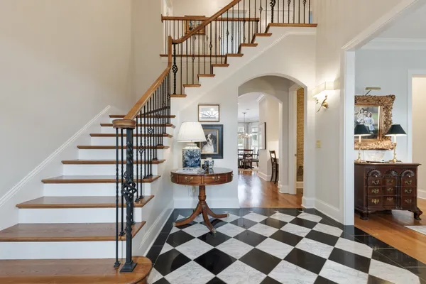 a view of entryway and hall with wooden floor