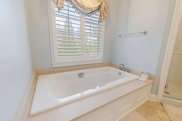 a bathroom with a granite countertop sink mirror and a