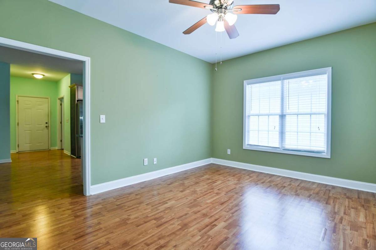 170 Meredith Ridge Road, Unit 8 Athens, GA 30605 - Photo 15 of 52 wooden floor in an empty room with a window