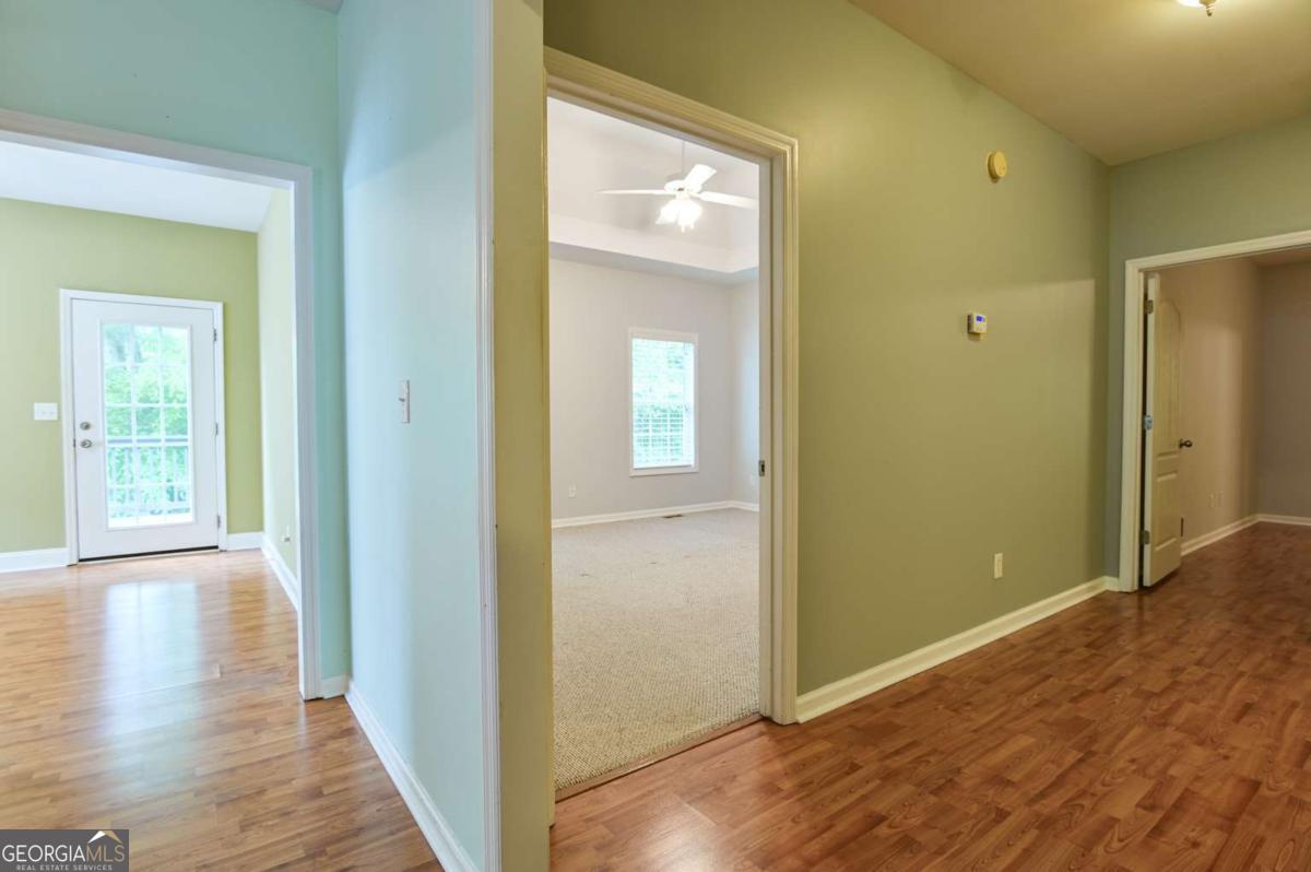 170 Meredith Ridge Road, Unit 8 Athens, GA 30605 - Photo 18 of 52 a view of a hallway with wooden floor