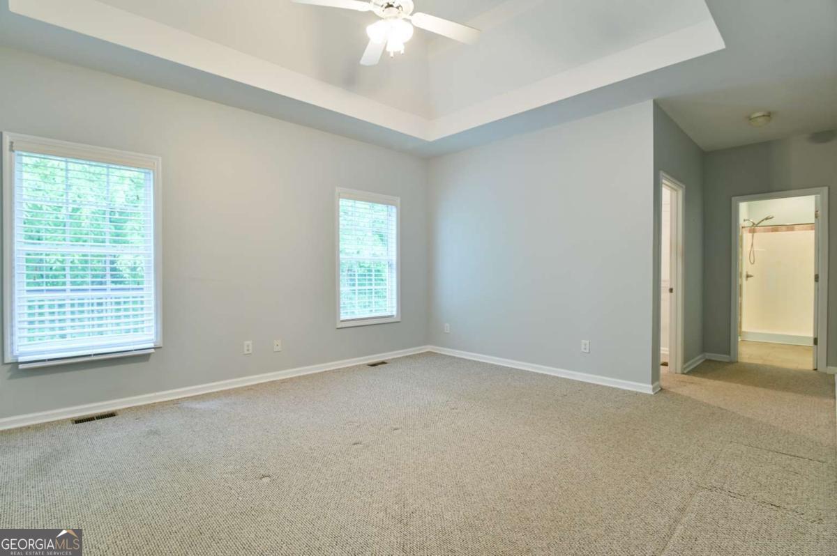 170 Meredith Ridge Road, Unit 8 Athens, GA 30605 - Photo 21 of 52 an empty room with windows and fan