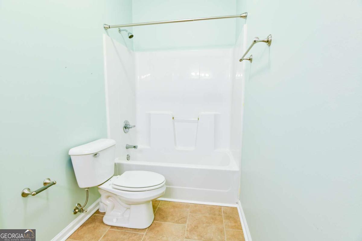 170 Meredith Ridge Road, Unit 8 Athens, GA 30605 - Photo 31 of 52 a bathroom with a toilet and a shower