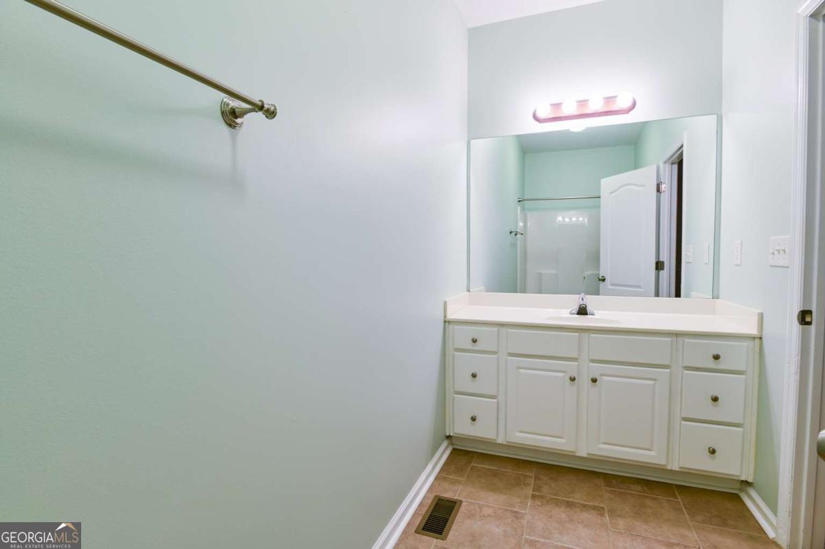 170 Meredith Ridge Road, Unit 8 Athens, GA 30605 - Photo 32 of 52 a spacious bathroom with a double vanity sink a mirror and a shower
