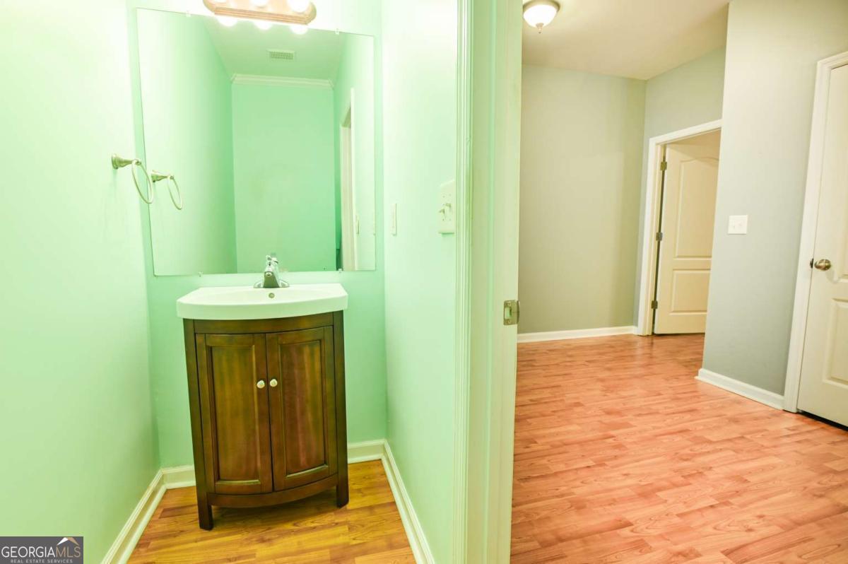 170 Meredith Ridge Road, Unit 8 Athens, GA 30605 - Photo 5 of 52 a bathroom with a sink and a mirror