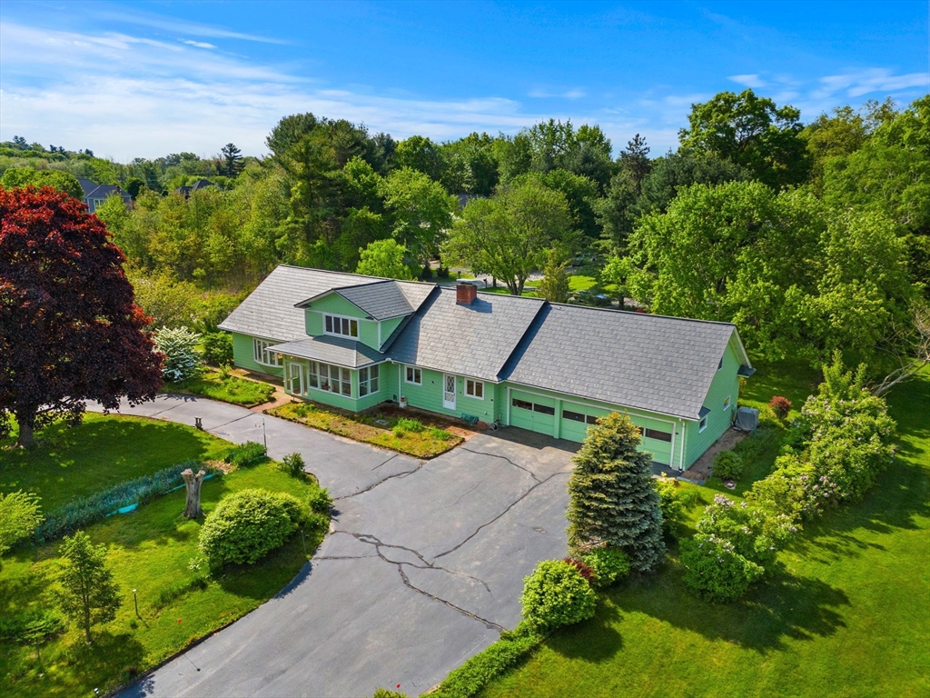 an aerial view of a house with a garden