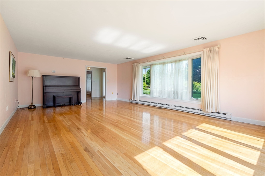 30 Bailey Road Andover, MA 01810 - Photo 11 of 37 a view of an empty room with wooden floor and a window