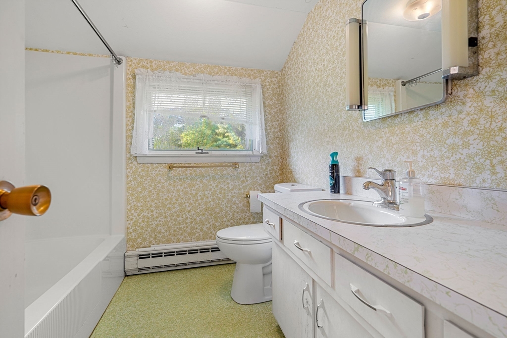 30 Bailey Road Andover, MA 01810 - Photo 24 of 37 a bathroom with a sink a toilet and a mirror