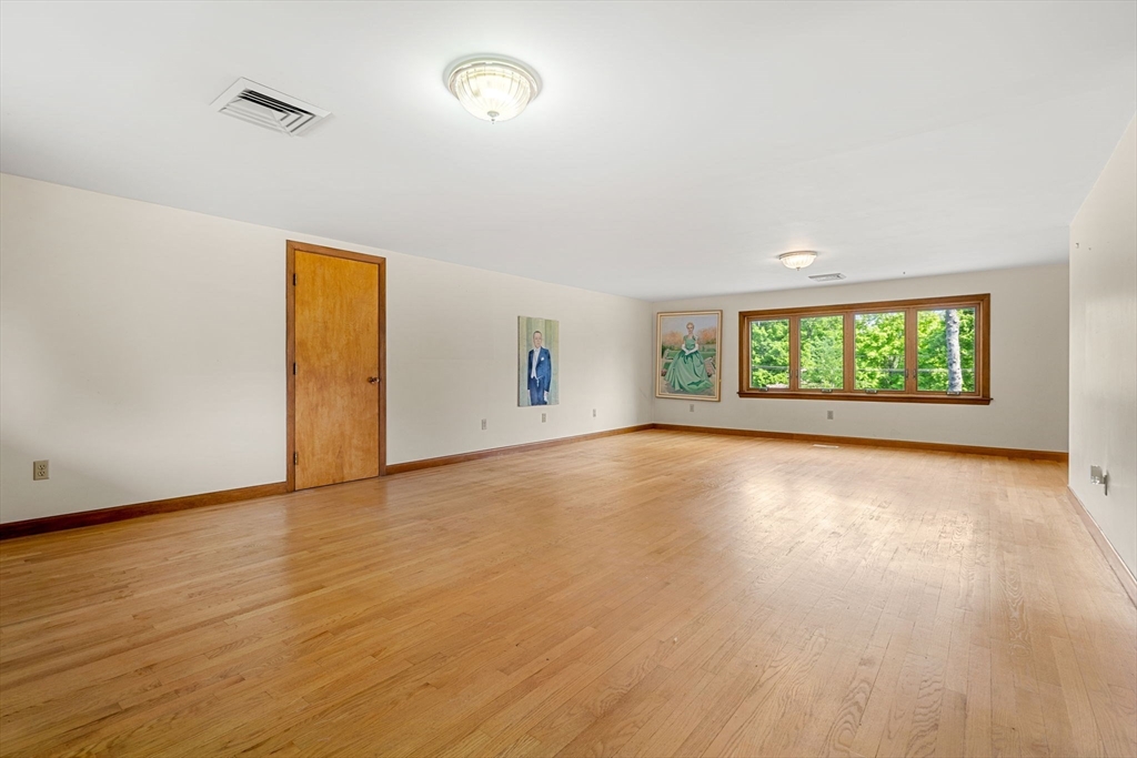 30 Bailey Road Andover, MA 01810 - Photo 25 of 37 an empty room with wooden floor and windows