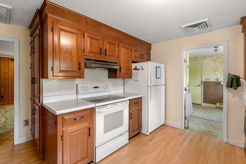 30 Bailey Road Andover, MA 01810 - Photo 5 of 37 a kitchen with a refrigerator sink and cabinets