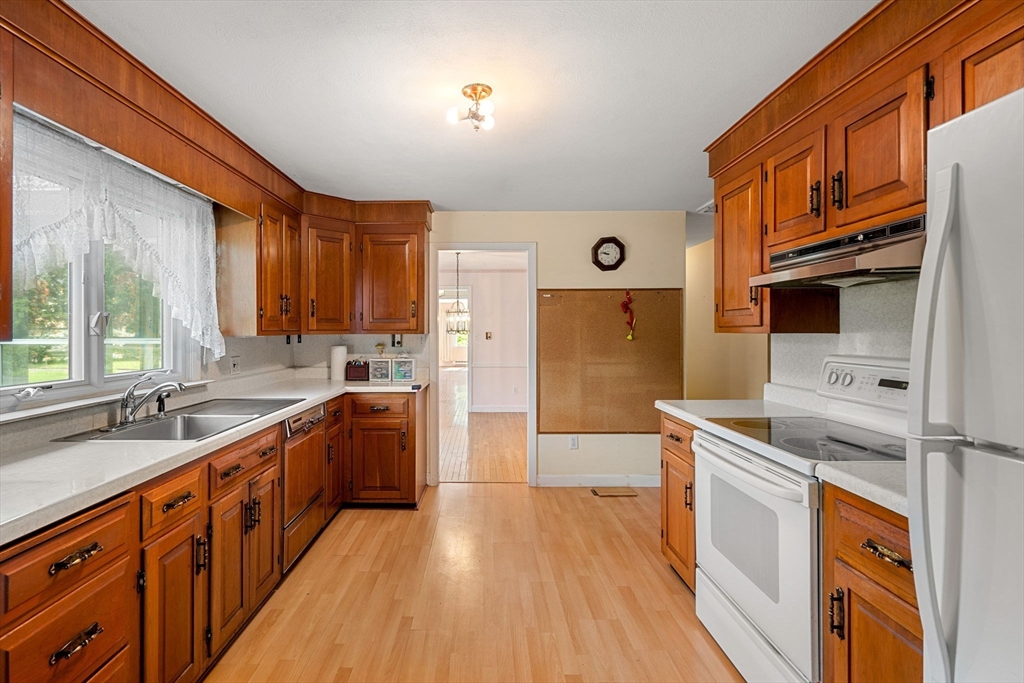 30 Bailey Road Andover, MA 01810 - Photo 6 of 37 a large kitchen with stainless steel appliances granite countertop a lot of counter space and wooden floors