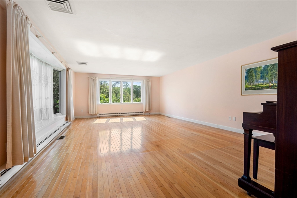 30 Bailey Road Andover, MA 01810 - Photo 9 of 37 wooden floor in an empty room with a window