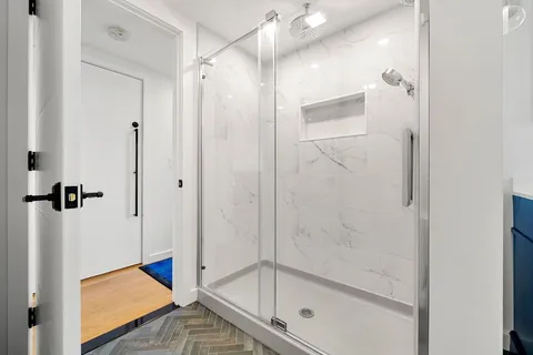 a view of a bedroom with furniture and windows