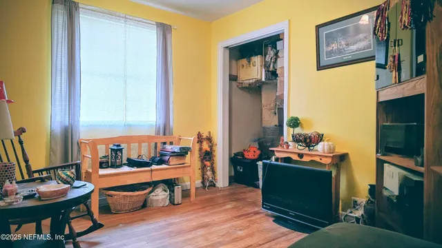 a living room with furniture and a flat screen tv
