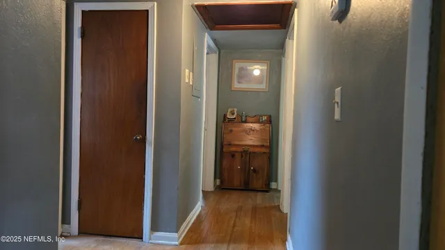 a view of a bathroom from a hallway