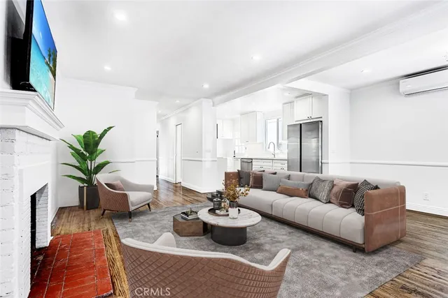 a living room with furniture potted plant and a window