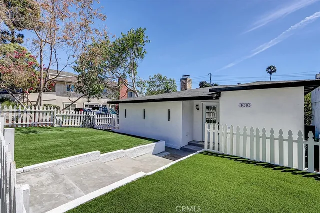 a view of a back yard of the house