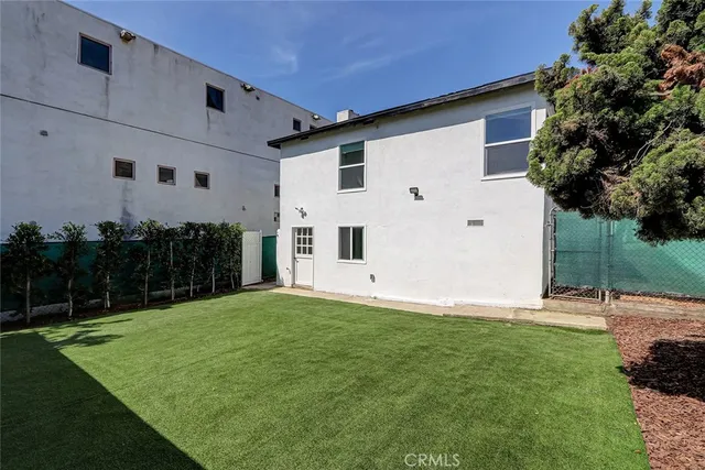 a view of a back yard of the house