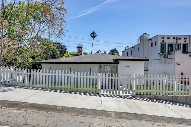 a view of a street with a small yard