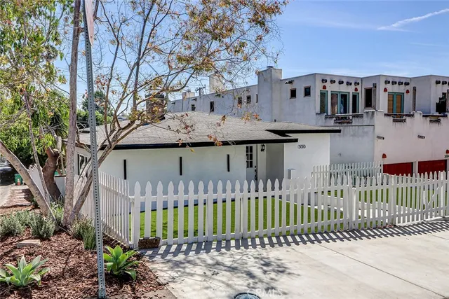 a view of a house with a small yard